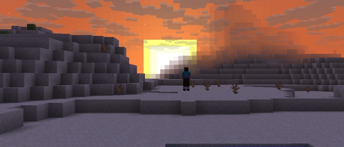A player standing on the snow against a sunset sky
